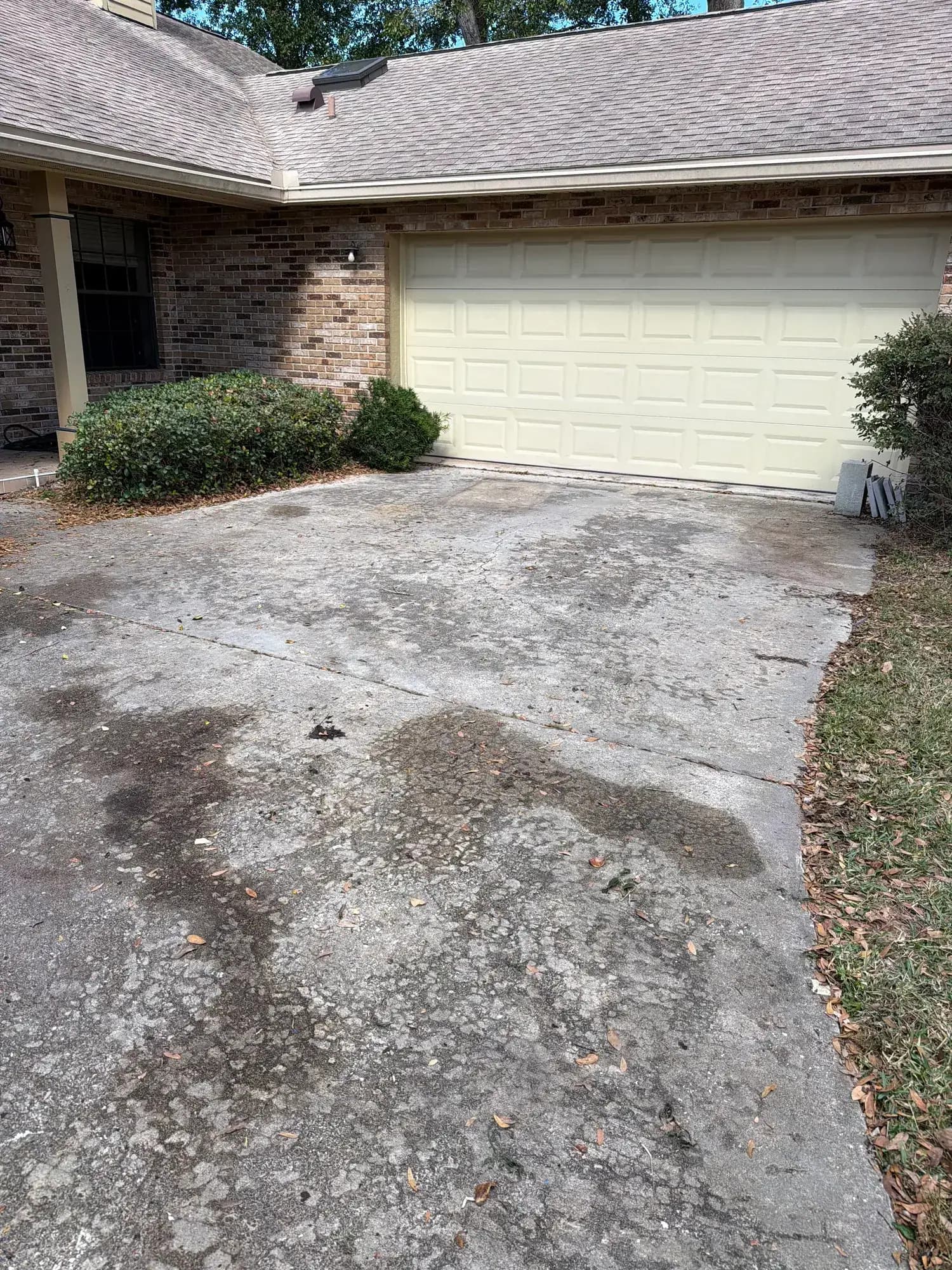 After: the same driveway swept clean after Big Rob's Hauling's garage cleanout