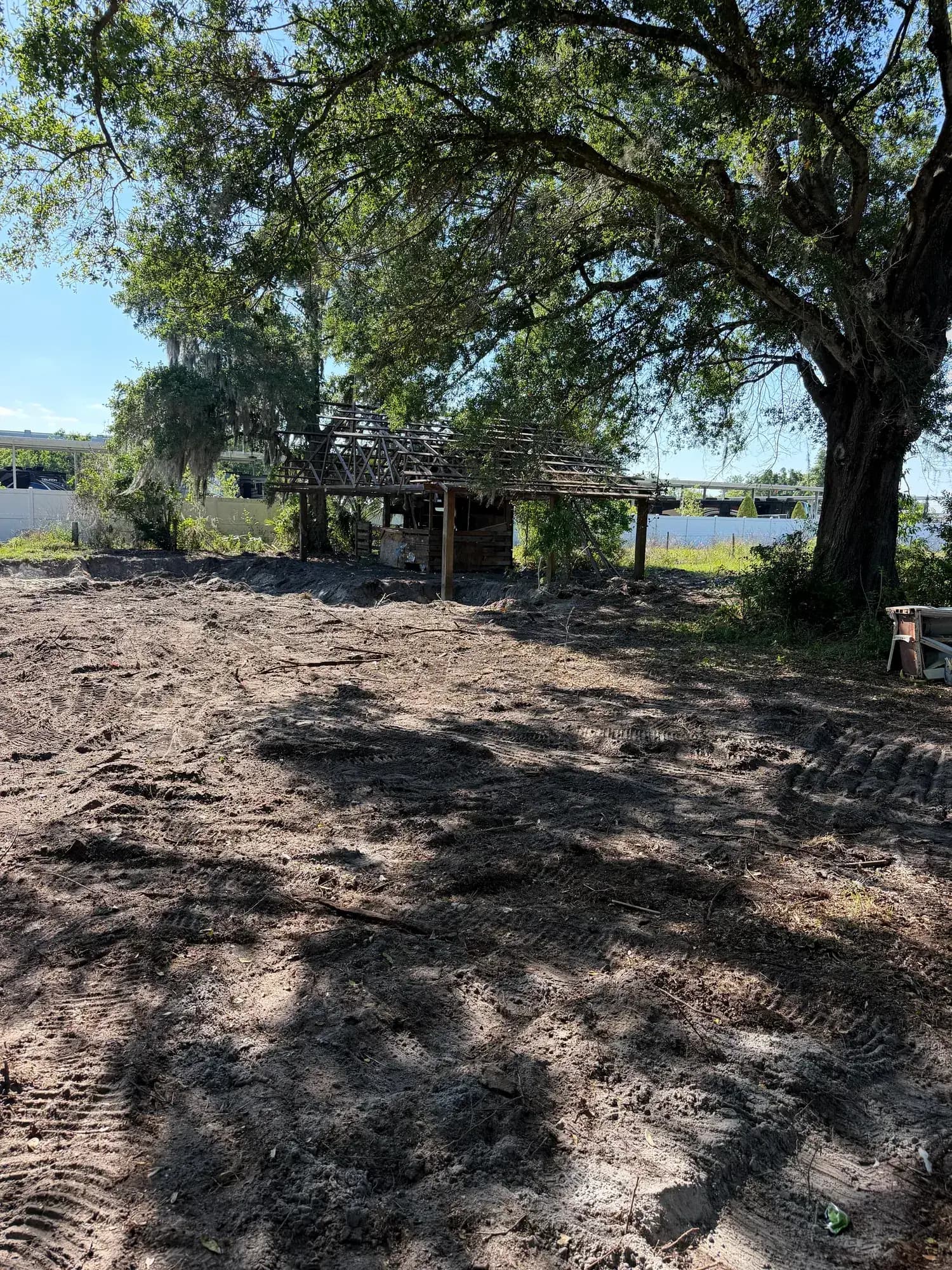 After: the same Lakeland, FL lot cleared and graded by Big Rob's Hauling, pavilion frame still standing