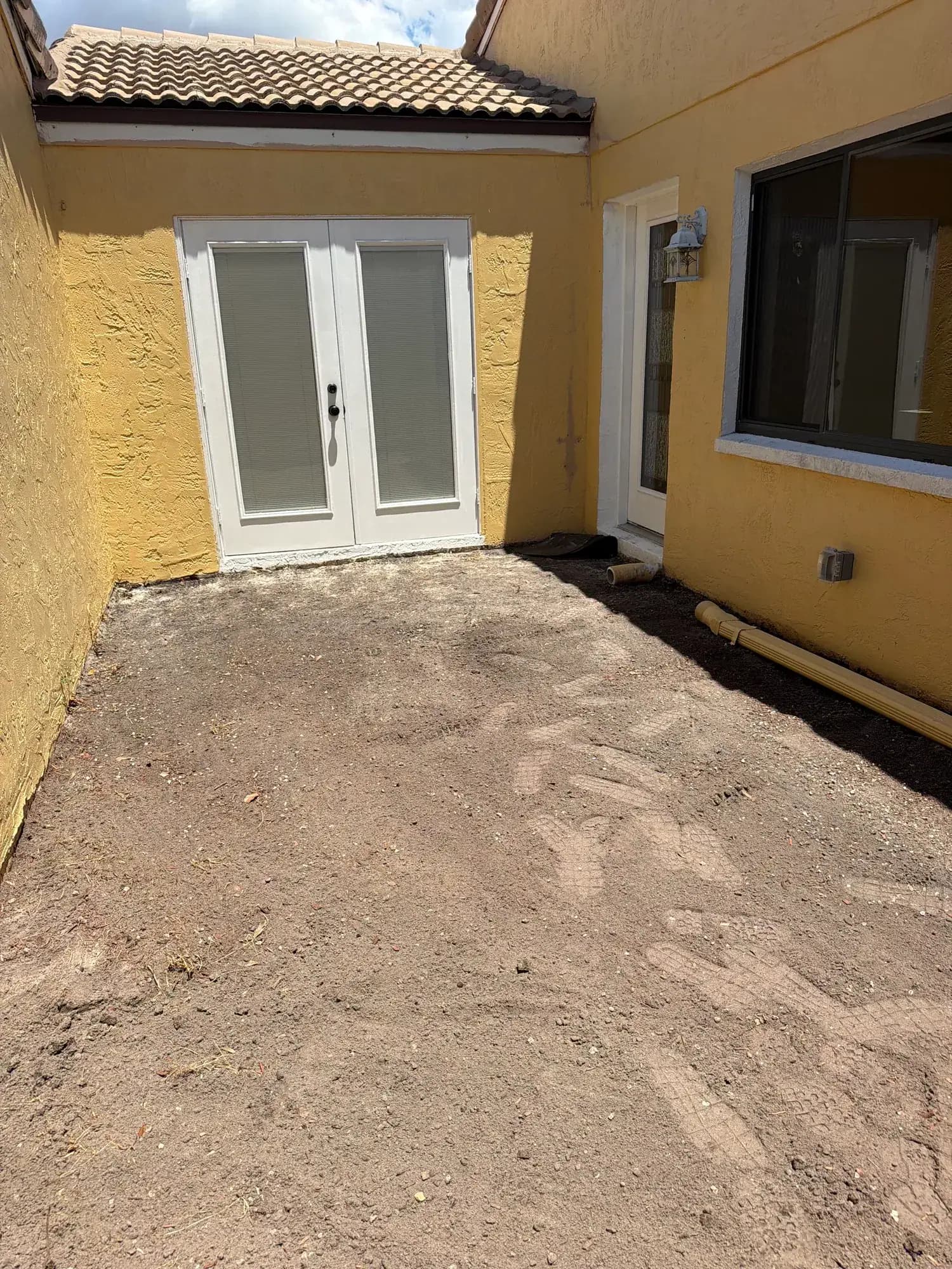 After: the same Winter Haven, FL patio cleared to bare ground by Big Rob's Hauling, ready for pavers