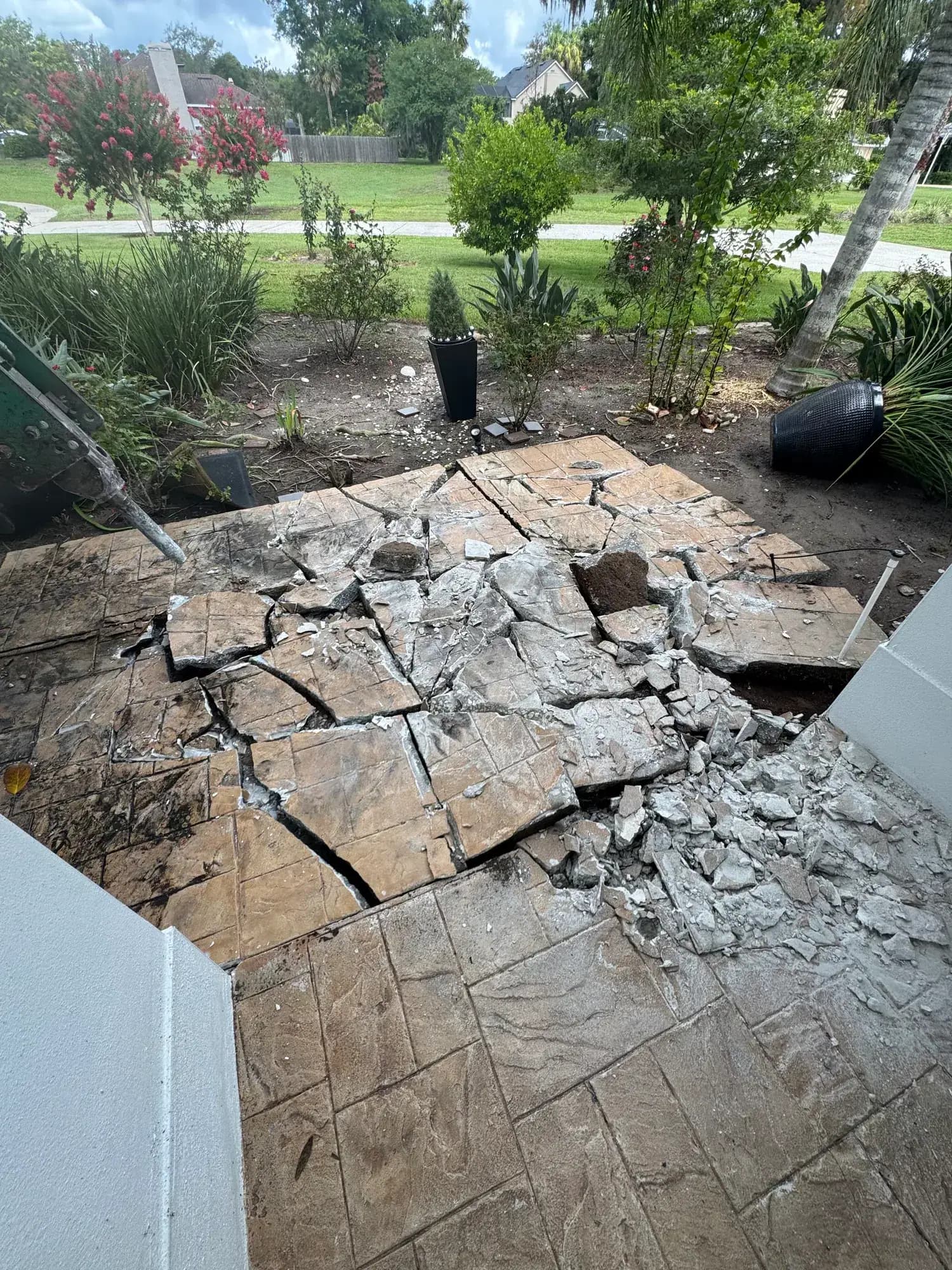 Broken concrete patio pavers staged for haul-out by Big Rob's Hauling in Polk County, FL