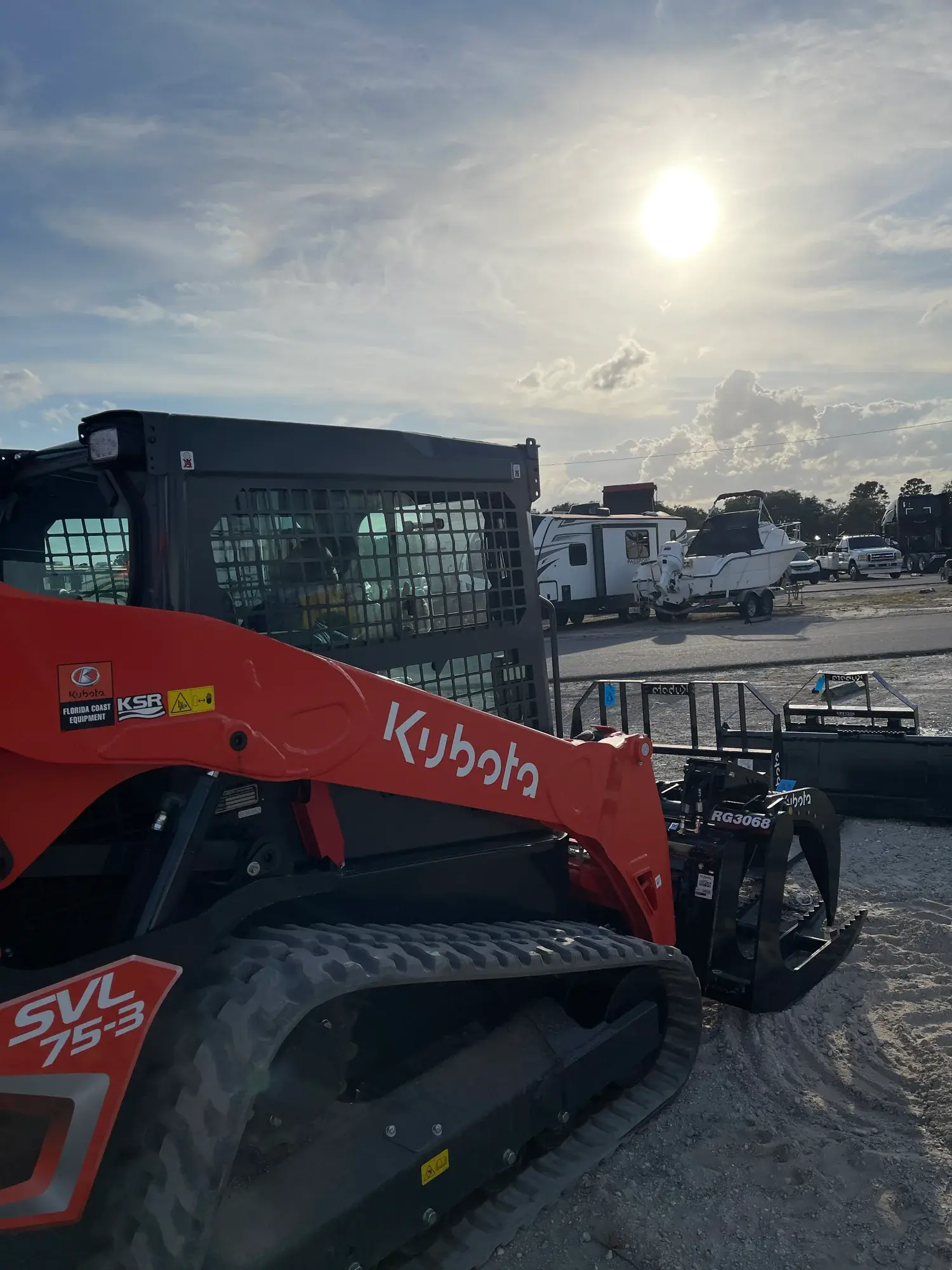 Big Rob's Hauling's Kubota SVL75-3 compact track loader on a Central Florida lot