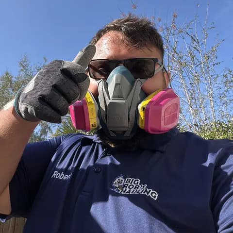 Rob of Big Rob's Hauling in a respirator and work gloves on a cleanout job in Polk County, FL
